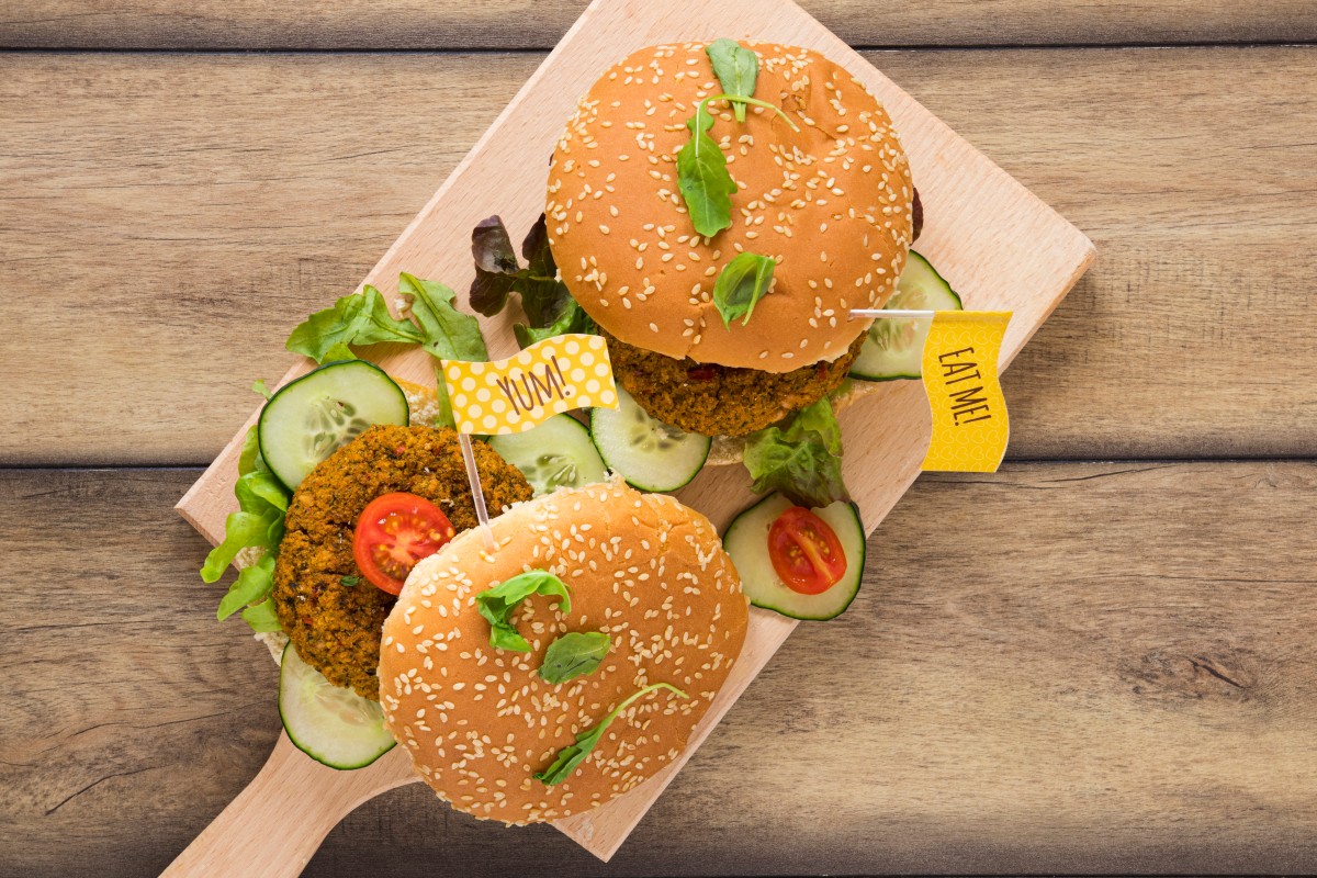top-view-delicious-vegan-burgers-wooden-board (1)